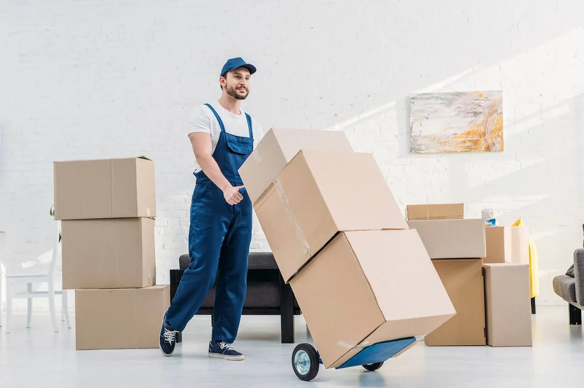 Cross country movers carrying furniture