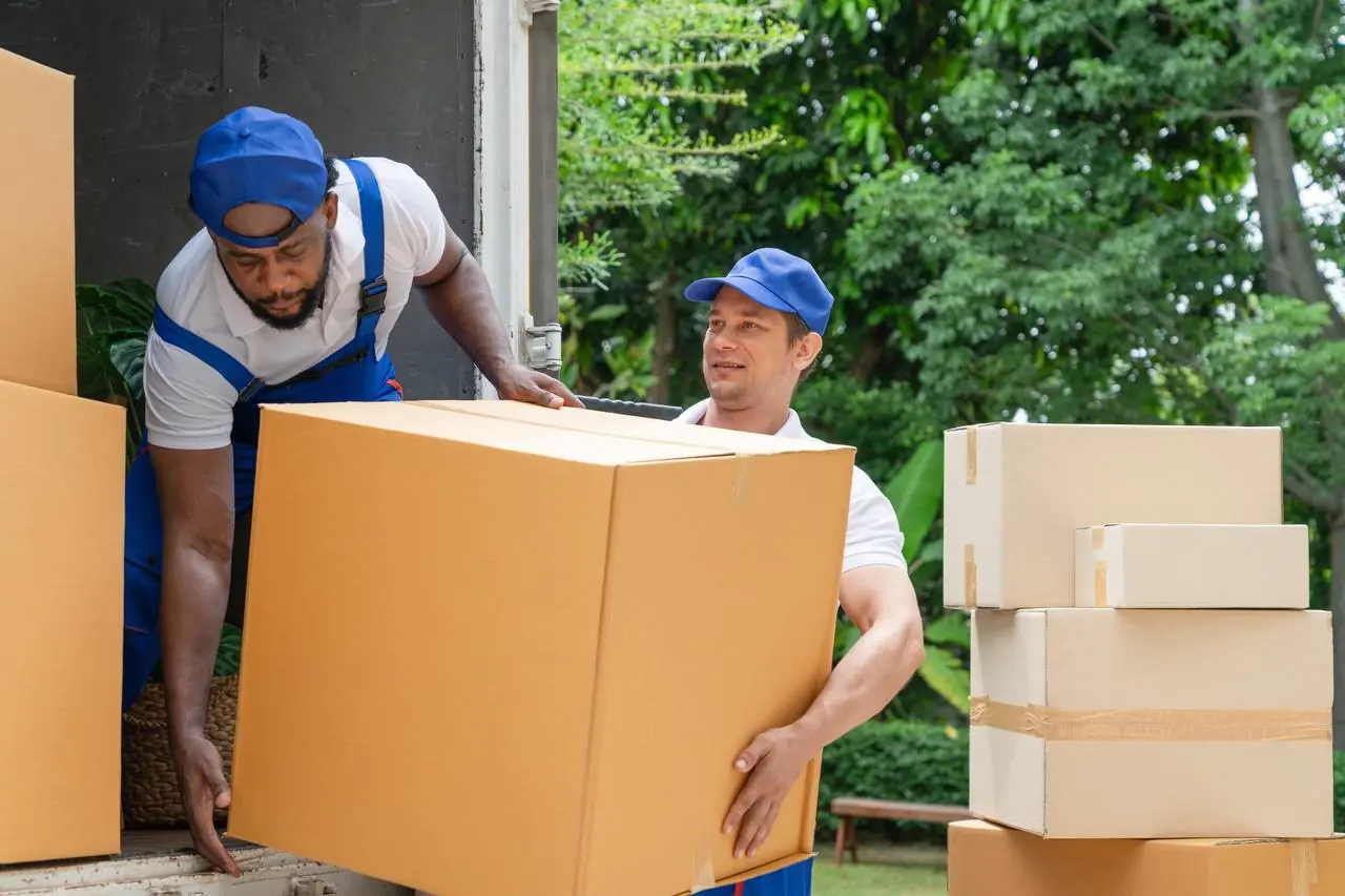 Movers in uniform loading moving van in Asheville, NC
