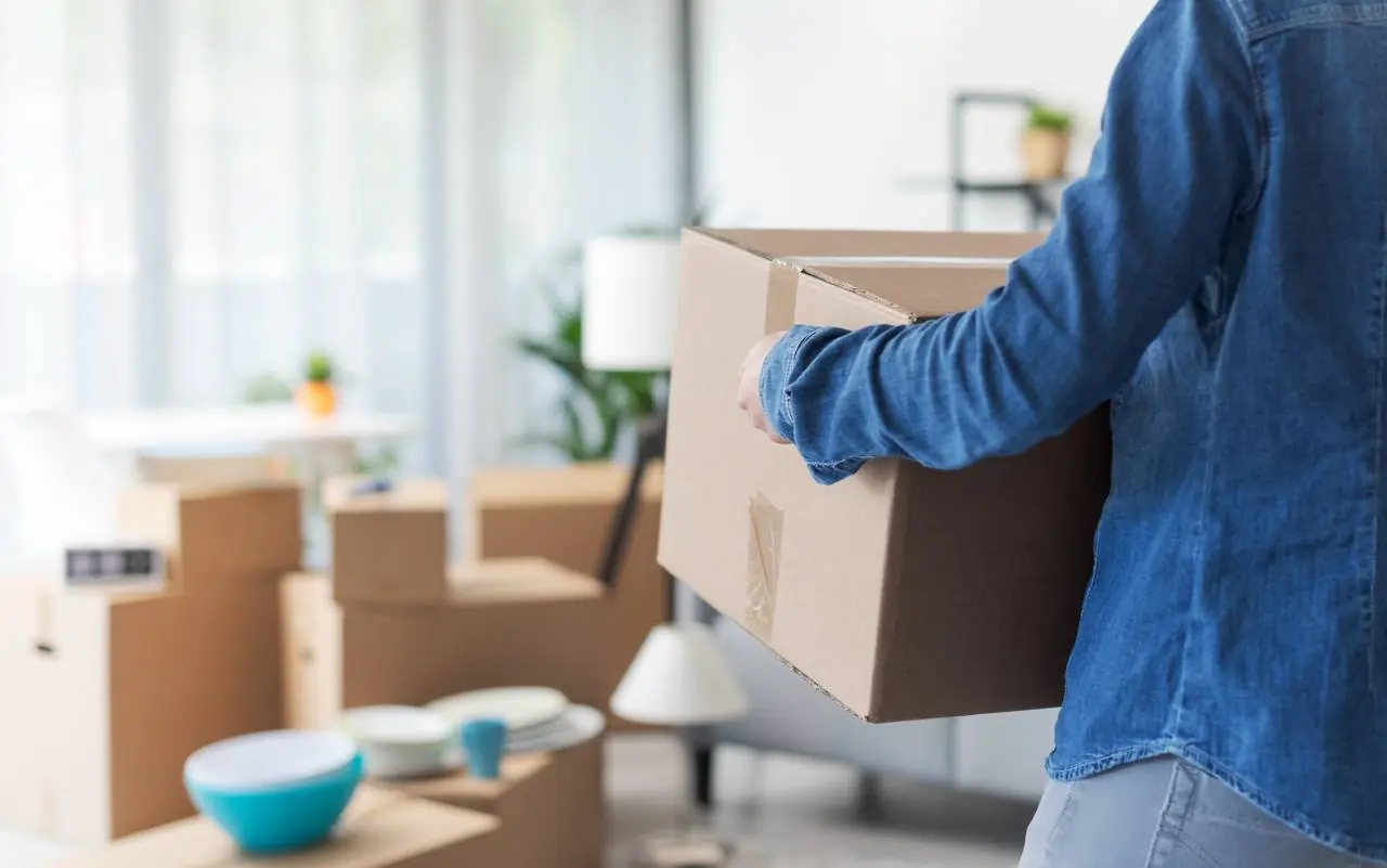 Movers unloading boxes at new home in McKinney, TX